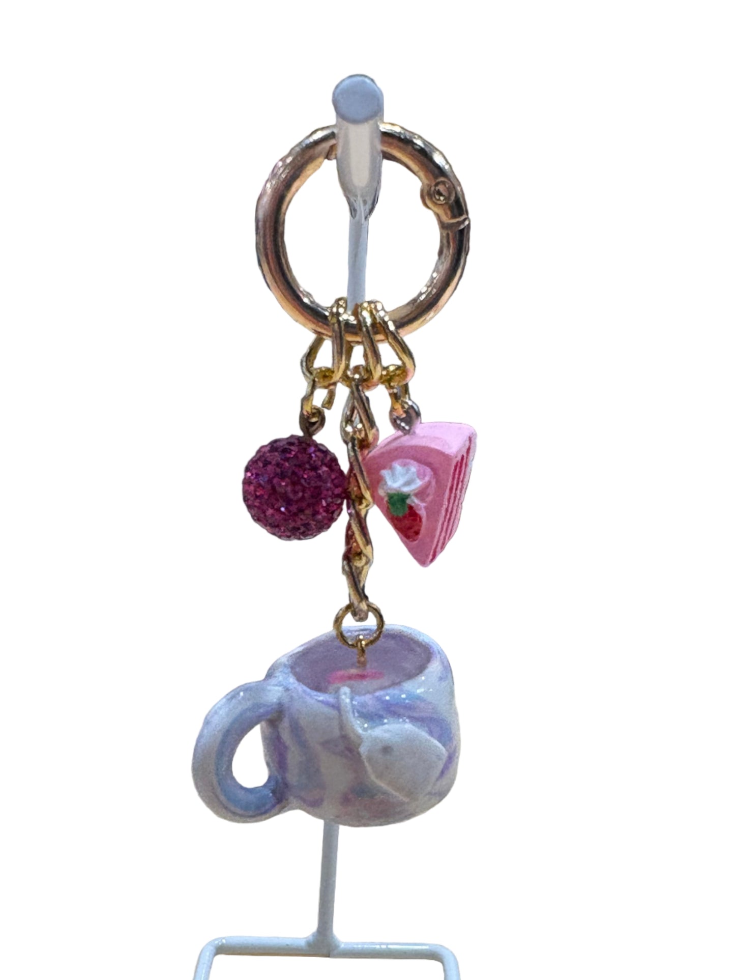 Tiny tea-themed keychain made from resin and polymer clay, featuring a small teacup charm paired with a miniature tea bag. The design is cute and whimsical, adding a playful touch to keys, bags, or backpacks while remaining lightweight and durable.